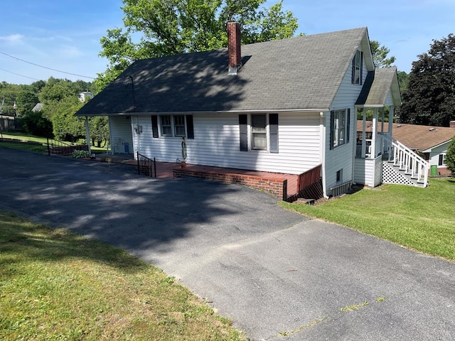 419 Adams St, Marion, VA 24354 - view of front of home featuring a chimney, roof with shingles, and a front lawn