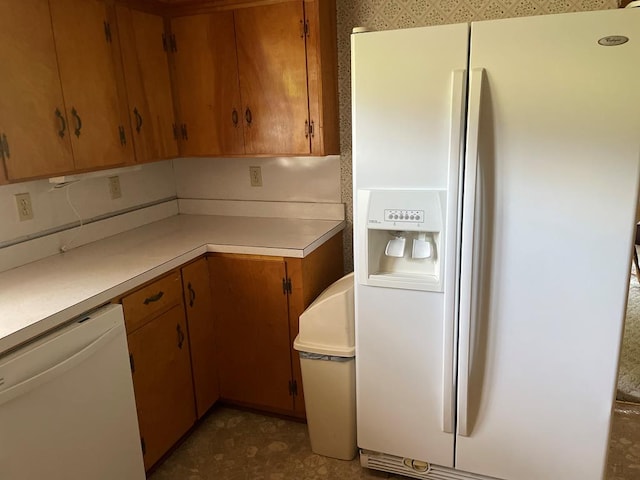 419 Adams St, Marion, VA 24354 - kitchen with white appliances, light countertops, and brown cabinets