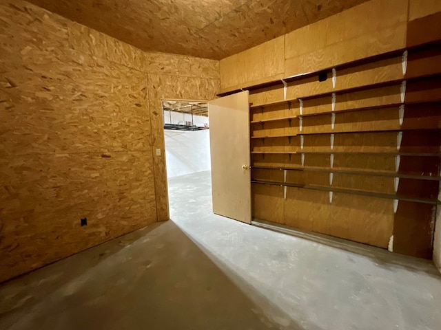 interior space featuring unfinished concrete flooring