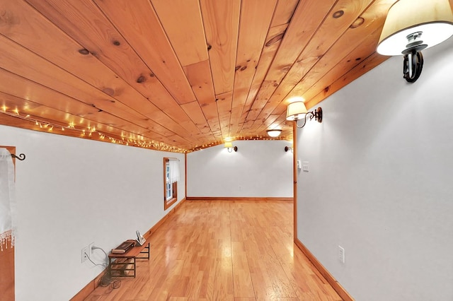 bonus room with wooden ceiling, light wood-type flooring, and vaulted ceiling