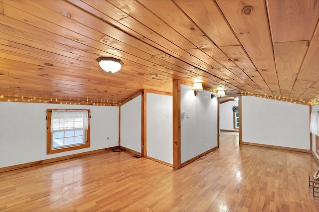 bonus room featuring wooden ceiling, light hardwood / wood-style flooring, and vaulted ceiling