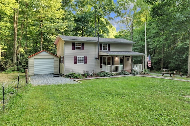 view of property with covered porch, a front lawn, a garage, and a storage unit