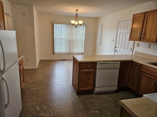 kitchen with a notable chandelier, a peninsula, white appliances, baseboards, and light countertops