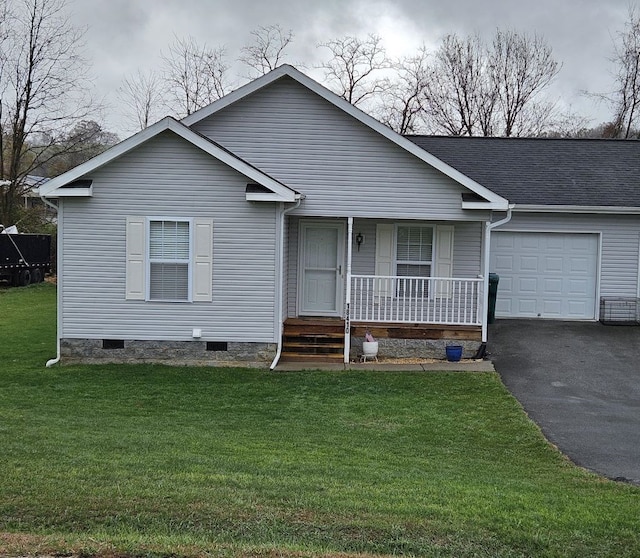 view of front facade with covered porch, a garage, driveway, crawl space, and a front yard