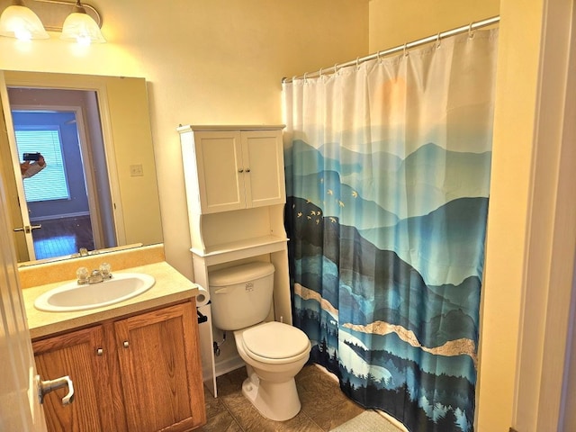 bathroom featuring toilet, tile patterned floors, curtained shower, and vanity