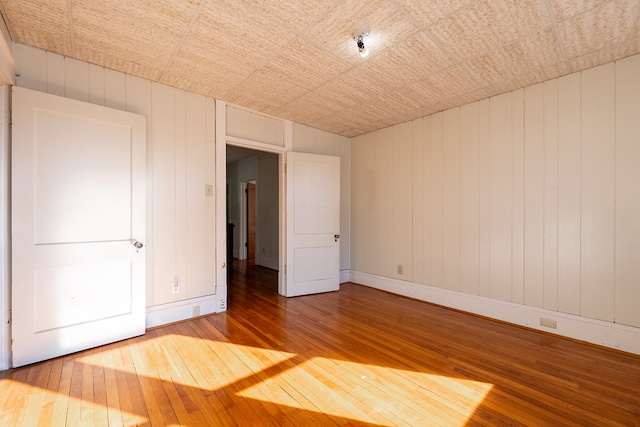 spare room featuring hardwood / wood-style floors