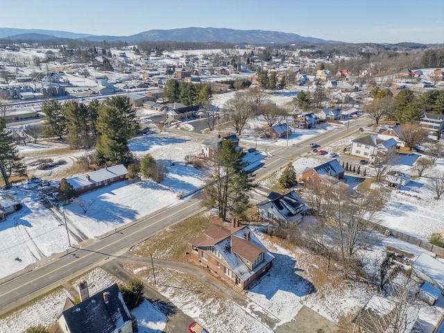 snowy aerial view with a mountain view