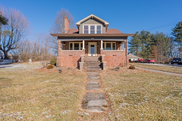 view of front of house featuring a front yard and a porch