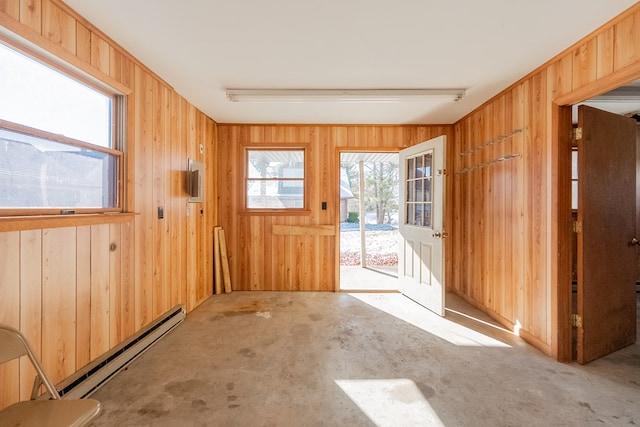 doorway to outside featuring light carpet and baseboard heating