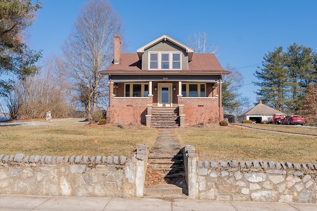 view of front of house with a porch and a front lawn