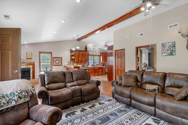 3003 Freestone Valley Rd, Tannersville, VA 24377 - living room featuring a ceiling fan, light wood finished floors, and a tiled fireplace