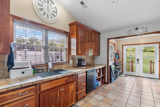 3003 Freestone Valley Rd, Tannersville, VA 24377 - kitchen featuring a sink, tile countertops, black dishwasher, healthy amount of natural light, and vaulted ceiling