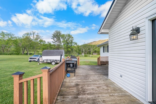 3003 Freestone Valley Rd, Tannersville, VA 24377 - wooden deck with a lawn, a storage unit, and an outdoor structure