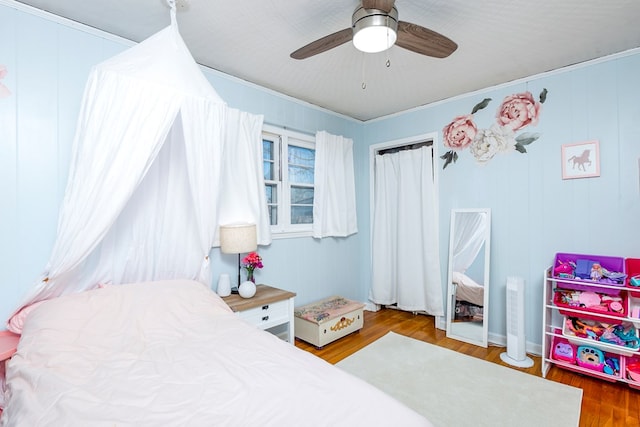 bedroom with hardwood / wood-style floors and ceiling fan