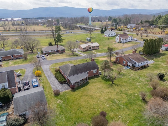 drone / aerial view featuring a mountain view and a rural view