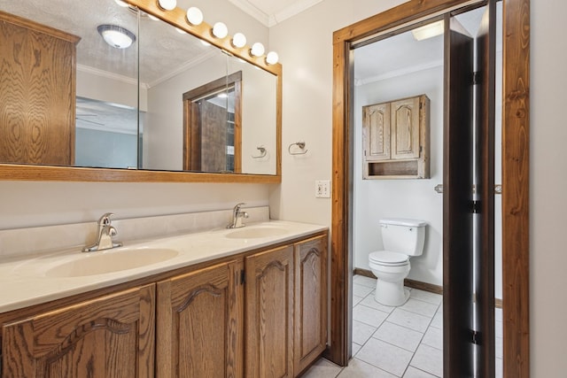 full bath with crown molding, a sink, and tile patterned floors