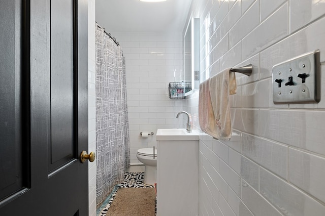 full bath featuring toilet, tile patterned floors, tile walls, and vanity