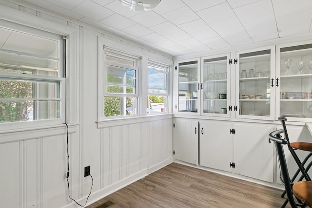 unfurnished sunroom with visible vents