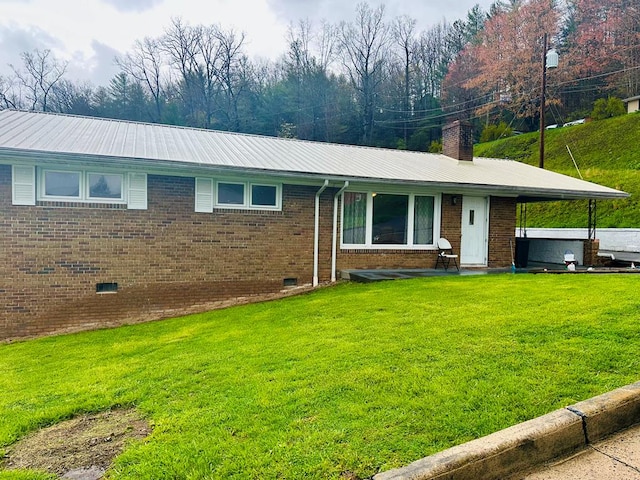 118 2nd Ave, Richlands, VA 24641 - ranch-style home with a front yard, brick siding, metal roof, and a chimney