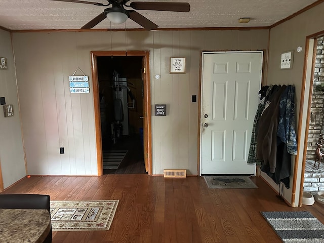 118 2nd Ave, Richlands, VA 24641 - foyer with dark wood-style flooring, a textured ceiling, ornamental molding, and ceiling fan