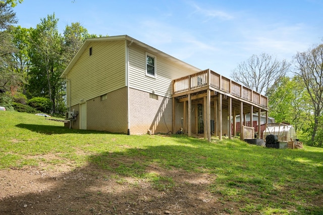 156 Ridgecrest St, Bluefield, VA 24605 - rear view of property with a lawn, a wooden deck, brick siding, a greenhouse, and an outbuilding
