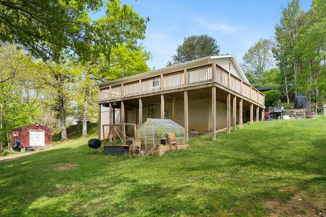 156 Ridgecrest St, Bluefield, VA 24605 - rear view of house featuring an outdoor structure, a lawn, a greenhouse, and a deck
