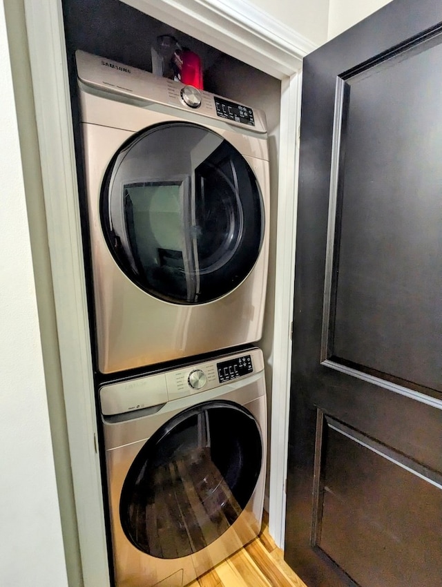 1251 Epperly Mill Rd, Floyd, VA 24091 - washroom featuring stacked washer and clothes dryer and wood finished floors