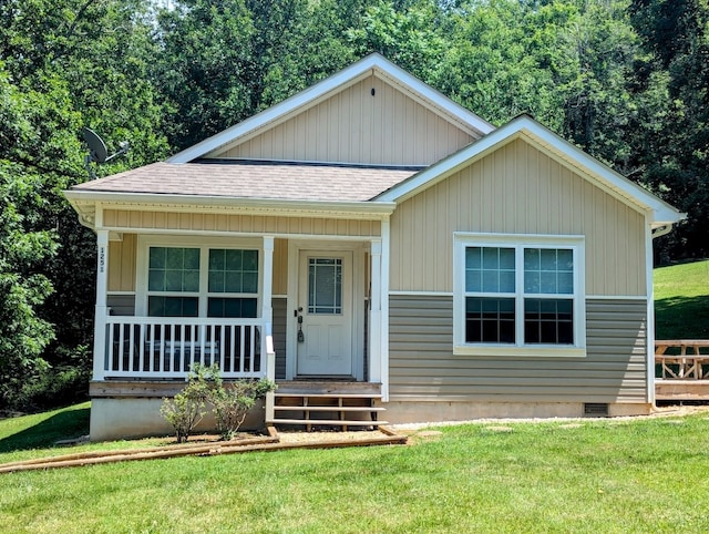 1251 Epperly Mill Rd, Floyd, VA 24091 - view of front facade featuring roof with shingles, a front yard, and covered porch