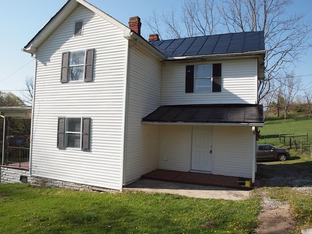 513 Adwolfe Rd, Marion, VA 24354 - back of property featuring a chimney and a lawn