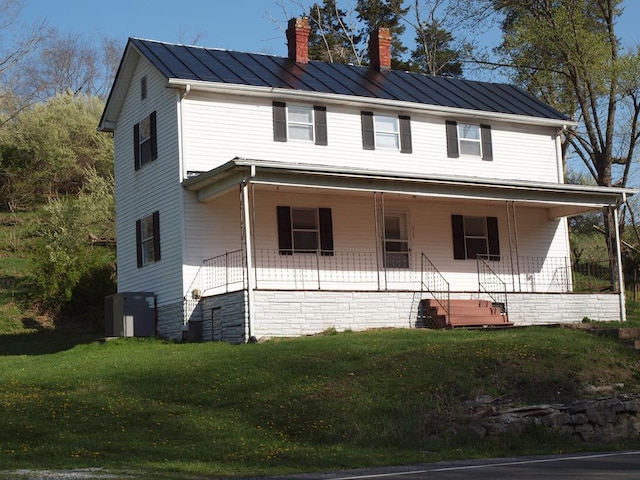 513 Adwolfe Rd, Marion, VA 24354 - view of front of house with a chimney, a standing seam roof, a front yard, a metal roof, and covered porch
