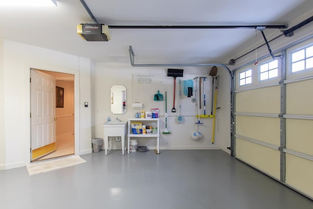 garage featuring baseboards and a garage door opener