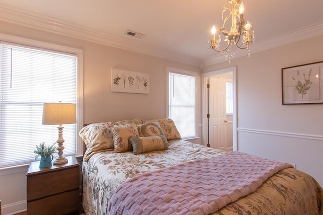 bedroom with a chandelier, ornamental molding, and visible vents