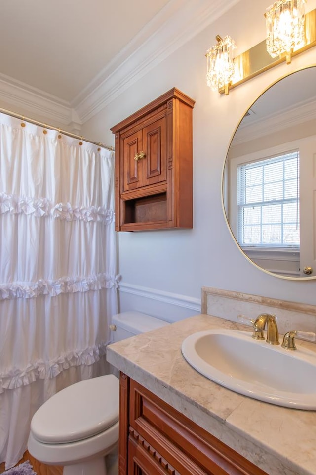 full bath with ornamental molding, a shower with curtain, vanity, and toilet