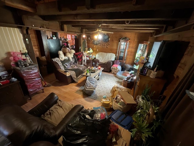 miscellaneous room with wood finished floors, wooden walls, and beam ceiling