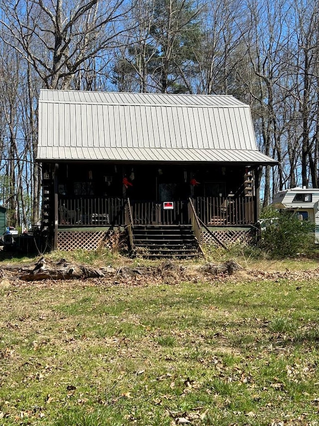 view of front of property with covered porch and metal roof