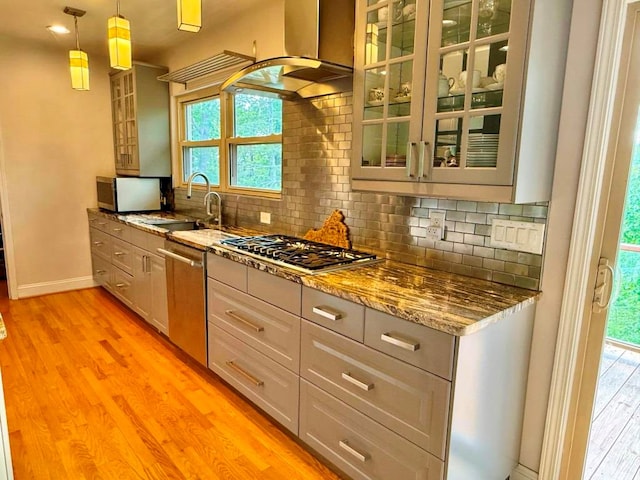 675 Pine Ridge Rd, Wytheville, VA 24382 - kitchen featuring appliances with stainless steel finishes, light wood-style floors, backsplash, light stone countertops, and glass insert cabinets