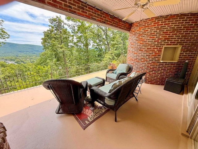 675 Pine Ridge Rd, Wytheville, VA 24382 - patio / terrace featuring a ceiling fan and a forest view