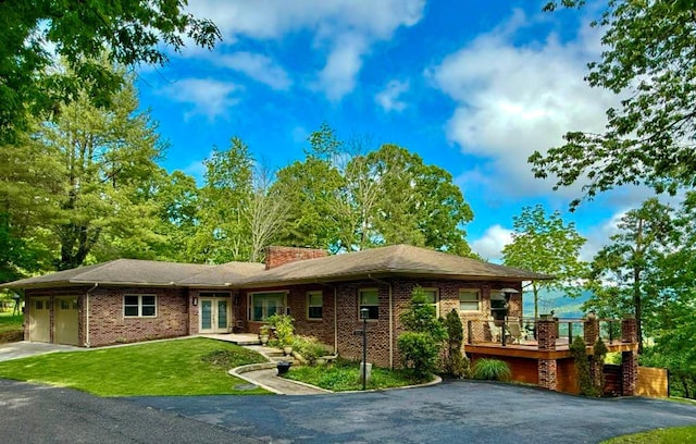 675 Pine Ridge Rd, Wytheville, VA 24382 - view of front of property featuring french doors, asphalt driveway, a garage, a front yard, and a chimney