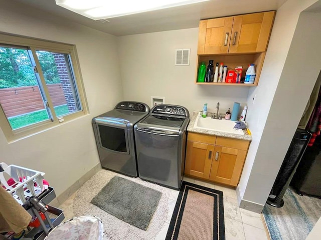 675 Pine Ridge Rd, Wytheville, VA 24382 - laundry area with washing machine and clothes dryer, cabinet space, and light tile patterned floors