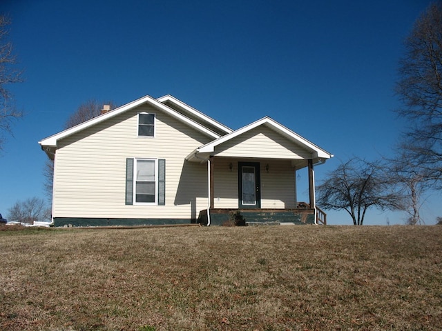 bungalow-style house featuring a front yard and covered porch