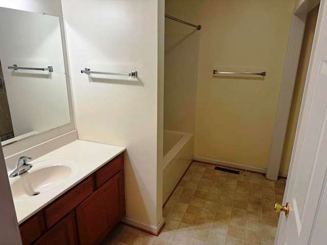 bathroom featuring visible vents and vanity