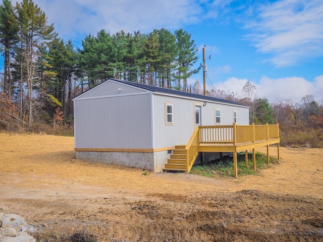 rear view of house with a deck