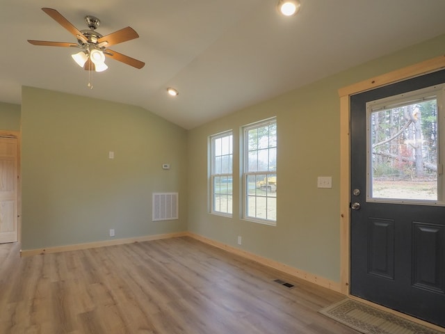 entrance foyer featuring lofted ceiling, light hardwood / wood-style floors, and ceiling fan