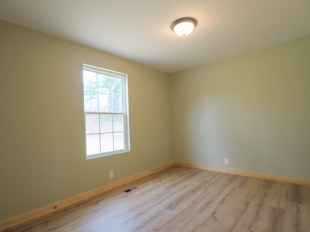 unfurnished room featuring light hardwood / wood-style floors