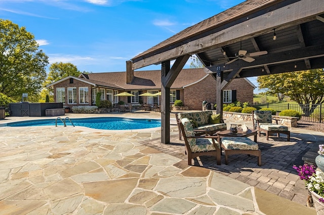 view of pool featuring a fenced in pool, a ceiling fan, outdoor lounge area, fence, and a patio area