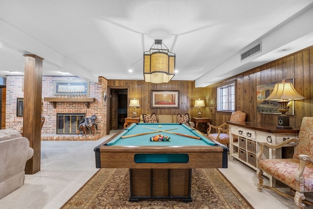 rec room with visible vents, carpet, wood walls, pool table, and a fireplace
