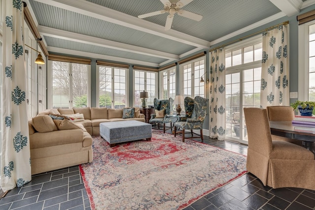 sunroom / solarium with stone tile flooring, crown molding, french doors, and beamed ceiling