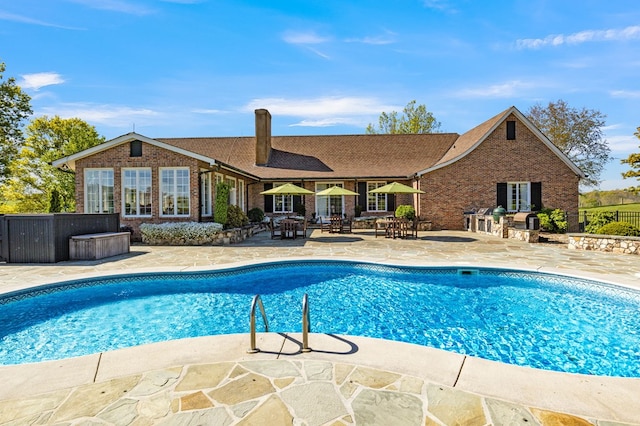 view of pool with a fenced in pool, a patio, and fence