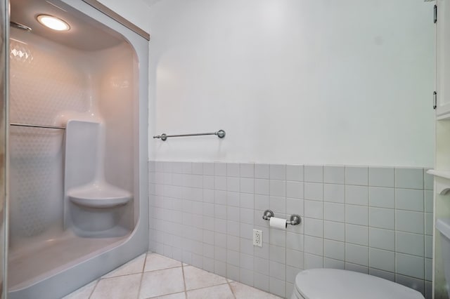 271 Burgan Rd, Pennington Gap, VA 24277 - full bathroom with tile walls, a shower, toilet, tile patterned floors, and wainscoting