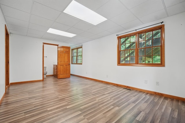 271 Burgan Rd, Pennington Gap, VA 24277 - empty room featuring a paneled ceiling, wood finished floors, and baseboards